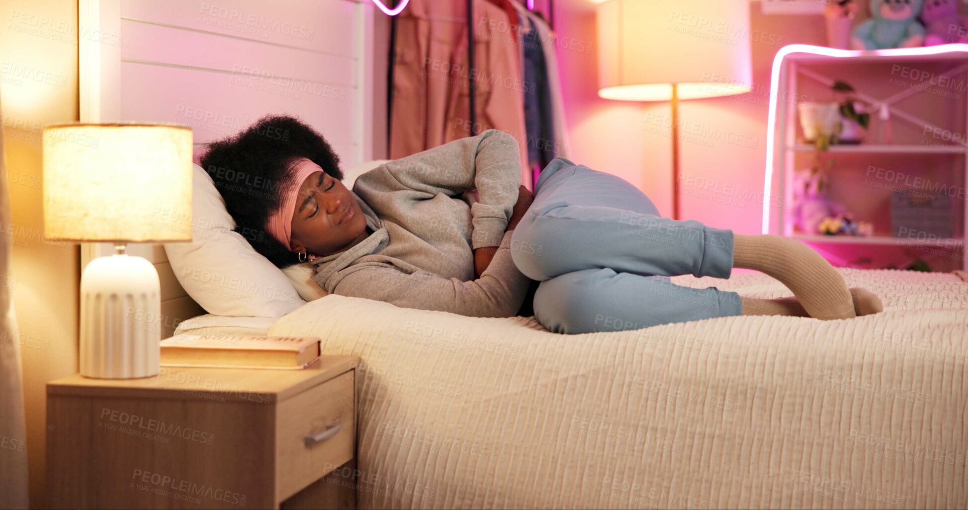 Buy stock photo Black woman, sickness and stress in bed with stomach pain, menstruation cramps or IBS symptoms. Girl, anxiety or discomfort in home bedroom with tummy ache, endometriosis or fetal position for relief