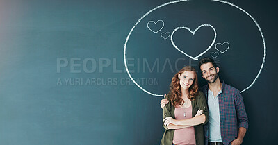 Buy stock photo Portrait of a young couple standing in front of a blackboard with a circle drawn around them