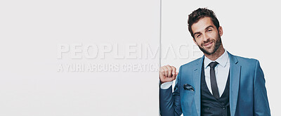 Buy stock photo Studio shot of a handsome businessman leaning against a wall isolated in white