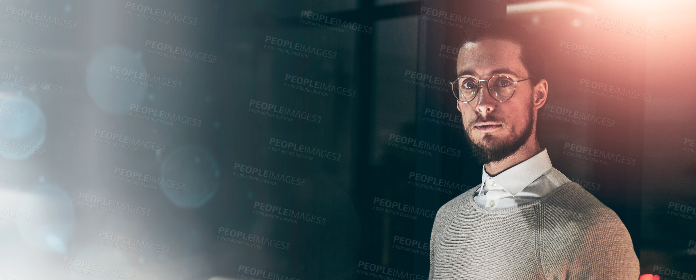 Buy stock photo Portrait of a handsome young designer working late in the office