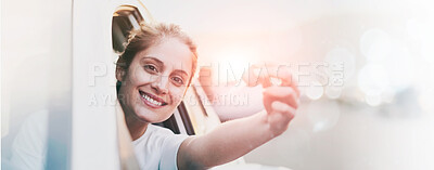 Buy stock photo Portrait of a young woman holding the keys to her car while sitting inside it