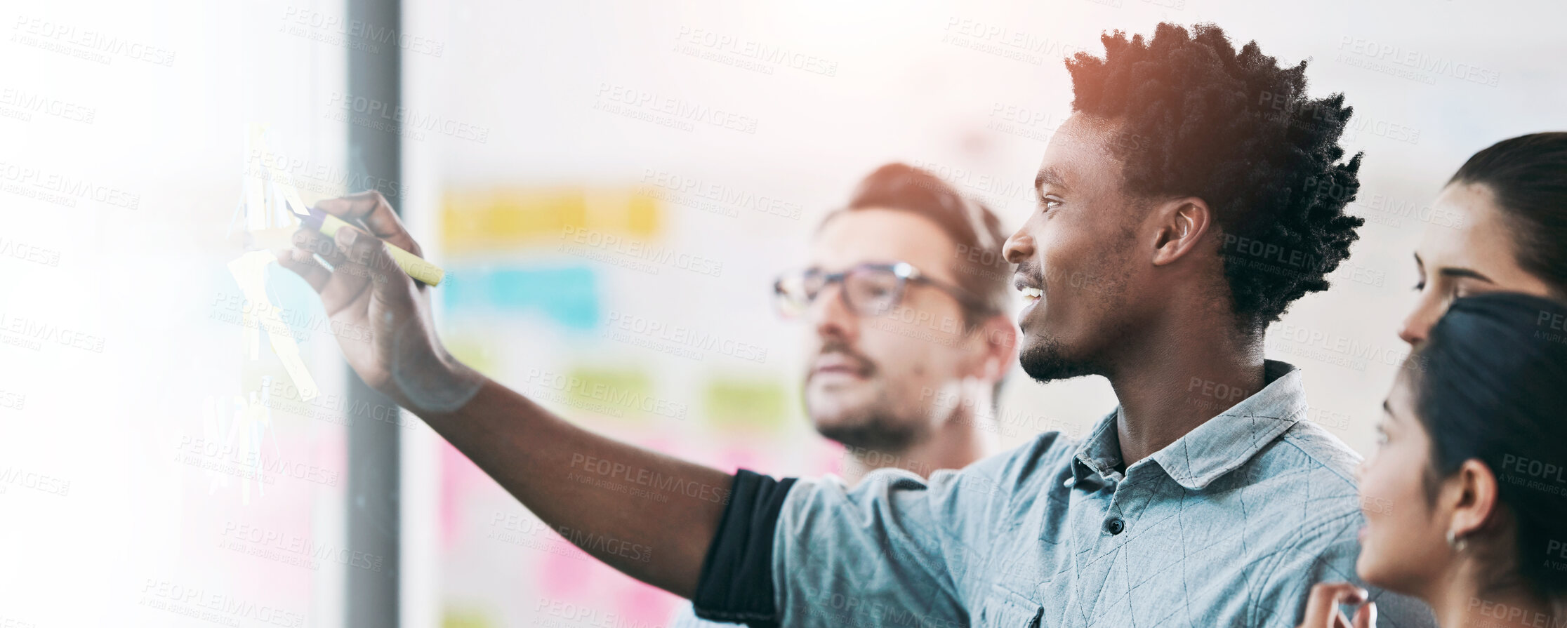 Buy stock photo Team diversity, sticky note and writing in office for idea, strategy and brainstorming in company. Group, thinking and black man with plan for workshop, teamwork and presentation on glass wall