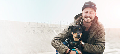 Buy stock photo Portrait of a young man and his dog spending time together outdoors