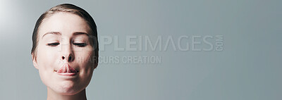 Buy stock photo Woman, skincare and studio with silly face on banner for beauty or hygiene on a gray background. Female person, model or tongue out with goofy expression for dermatology or glow up on mockup space