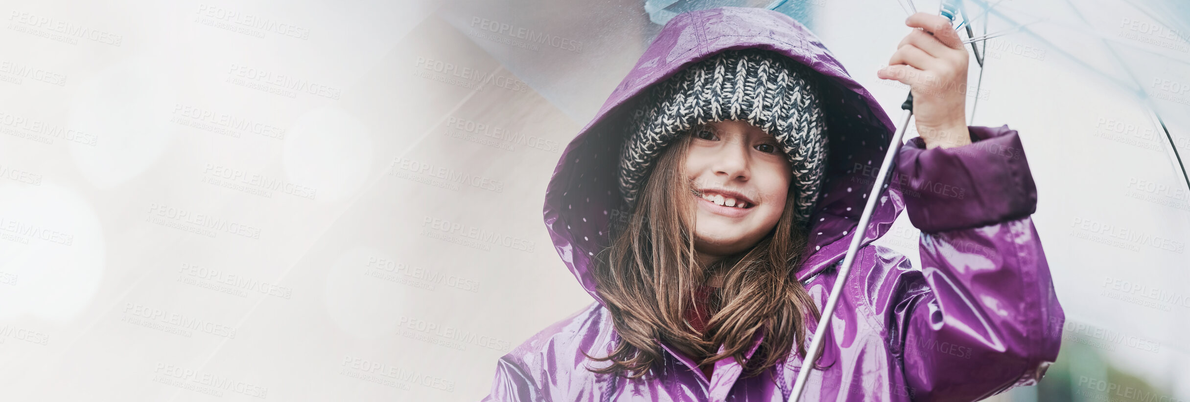 Buy stock photo Portrait of a little girl standing under an umbrella outside