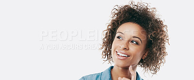 Buy stock photo Studio shot of an attractive young woman looking thoughtful against a white background