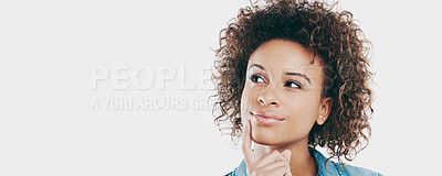 Buy stock photo Studio shot of an attractive young woman looking thoughtful against a white background