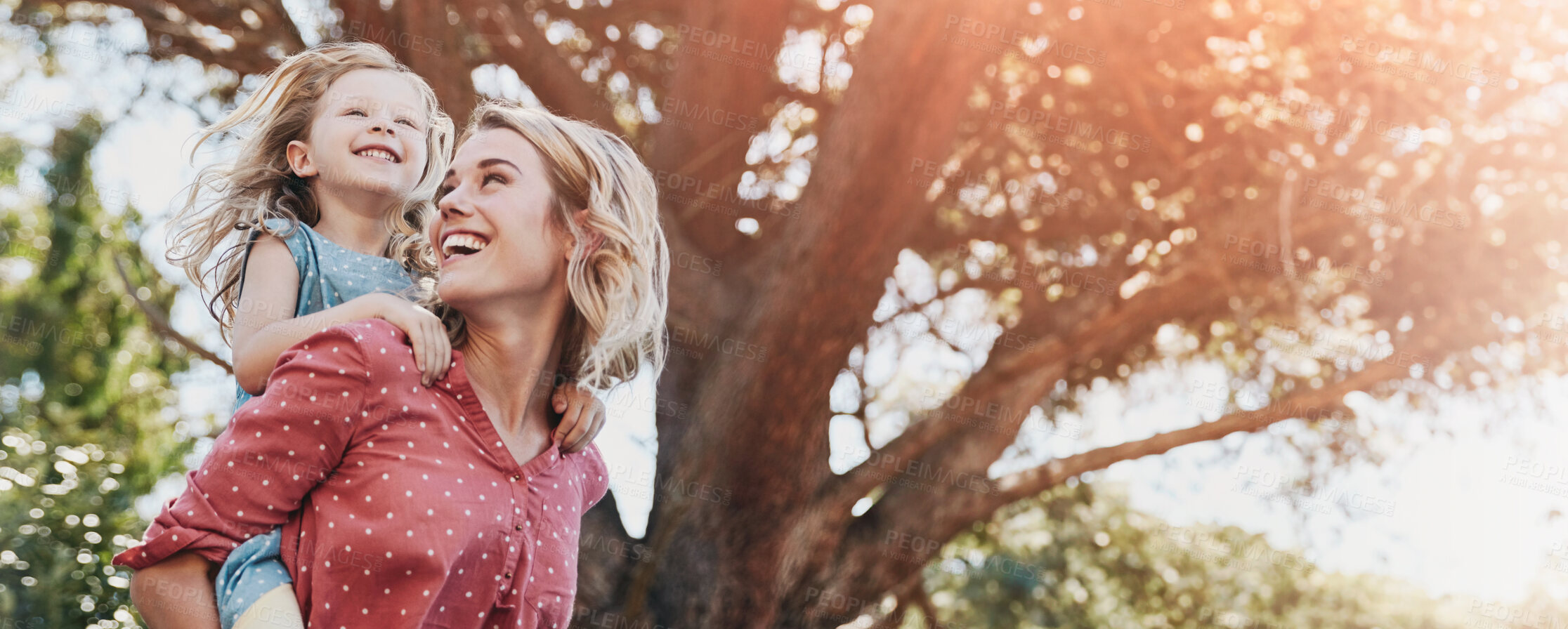 Buy stock photo Cropped shot of a mother and daughter enjoying a day outdoors together