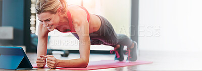 Buy stock photo Shot of a sporty young woman working out at home