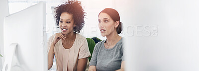 Buy stock photo Shot of two creative businesspeople working together on a computer in the office