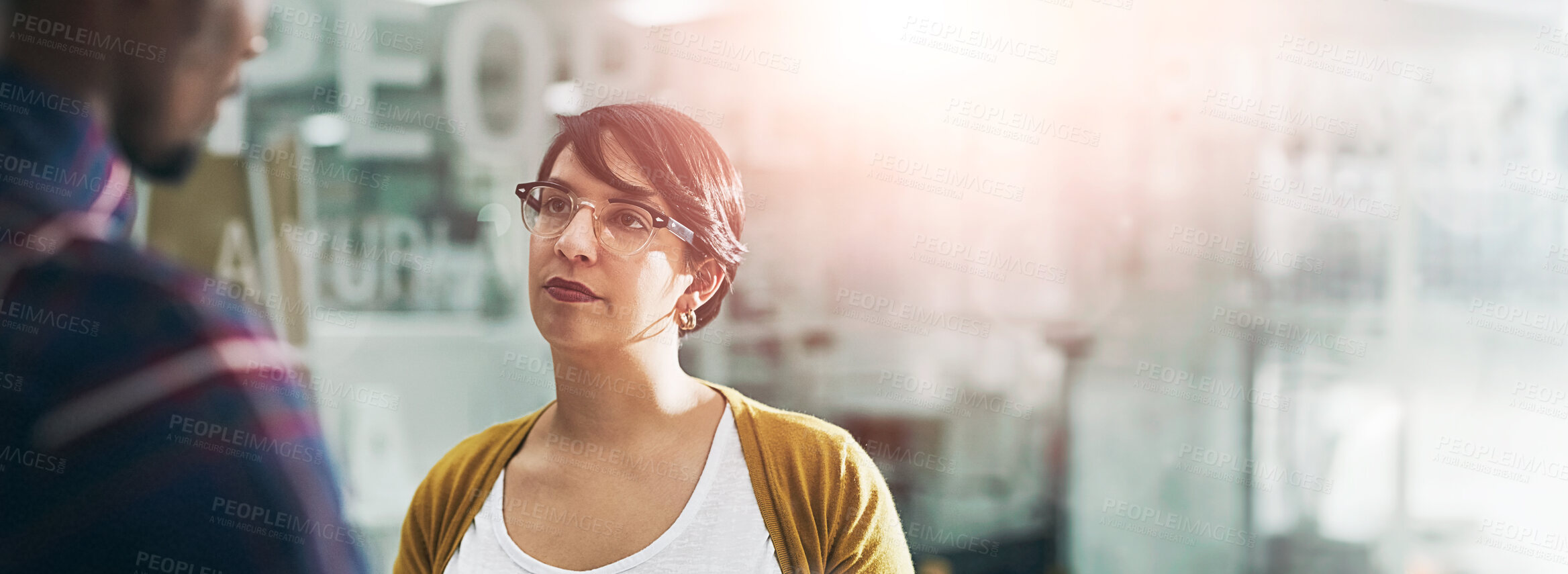 Buy stock photo Business, discussion and woman in office for meeting, advice or feedback on progress of project. Lens flare, graphic design agency and team manager for opinion, conversation or listening to coworker