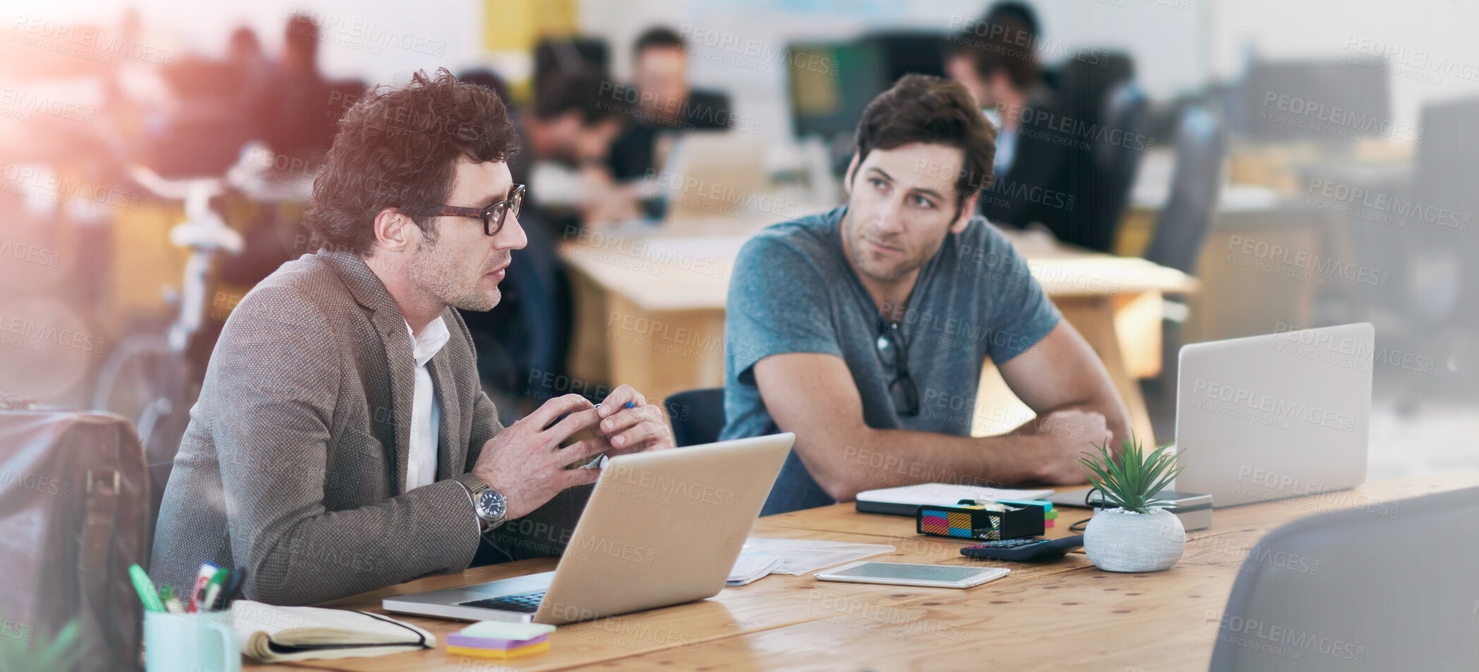 Buy stock photo Business people, discussion and laptop for collaboration on project, problem solving and teamwork. Men, partnership and together for planning in coworking office, brainstorming and conversation