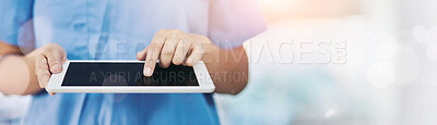 Buy stock photo Closeup shot of a medical practitioner using a digital tablet