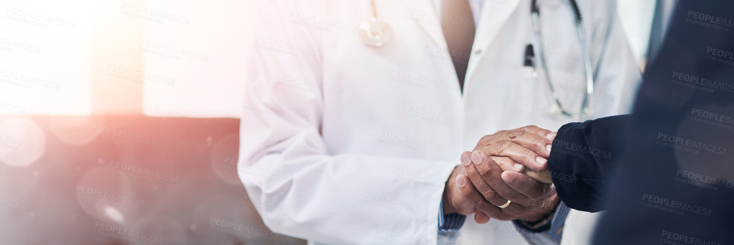 Buy stock photo Cropped shot of a doctor holding a patient's hand in comfort