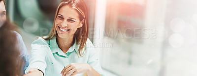 Buy stock photo Shot of two businesspeople shaking hands together at a table in an office while colleagues look on