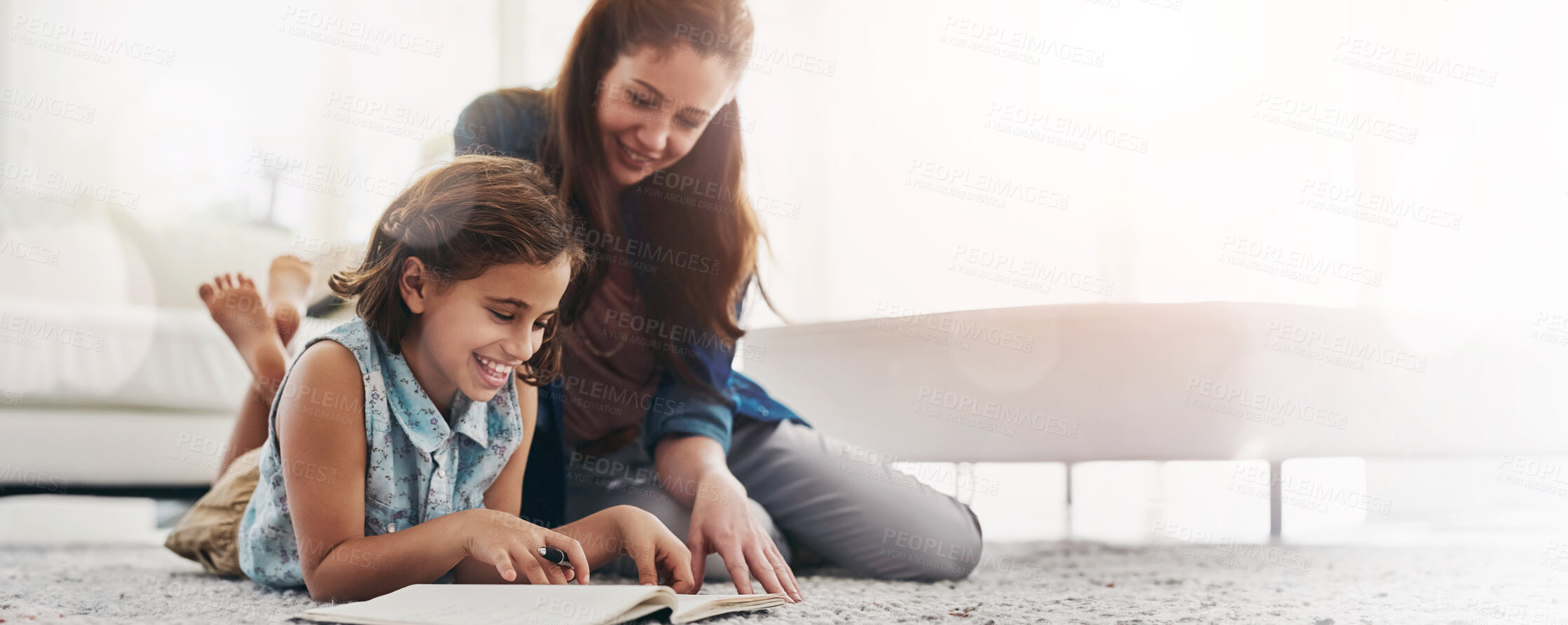 Buy stock photo Cropped shot of a mother helping her daughter with her homework