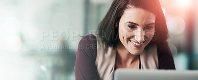 Buy stock photo Shot of a businesswoman sitting at her desk with her laptop