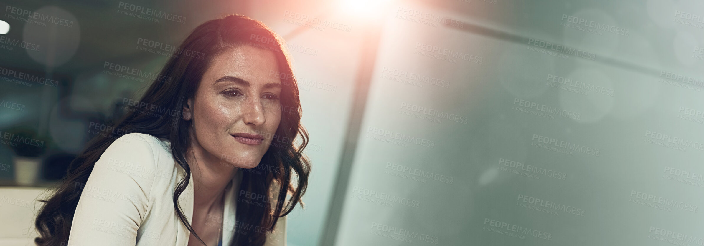 Buy stock photo Cropped shot of a young businesswoman working late on a computer in an office