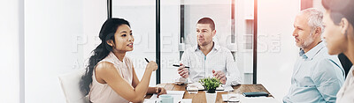 Buy stock photo Shot of a group of coworkers talking together in a meeting in an office