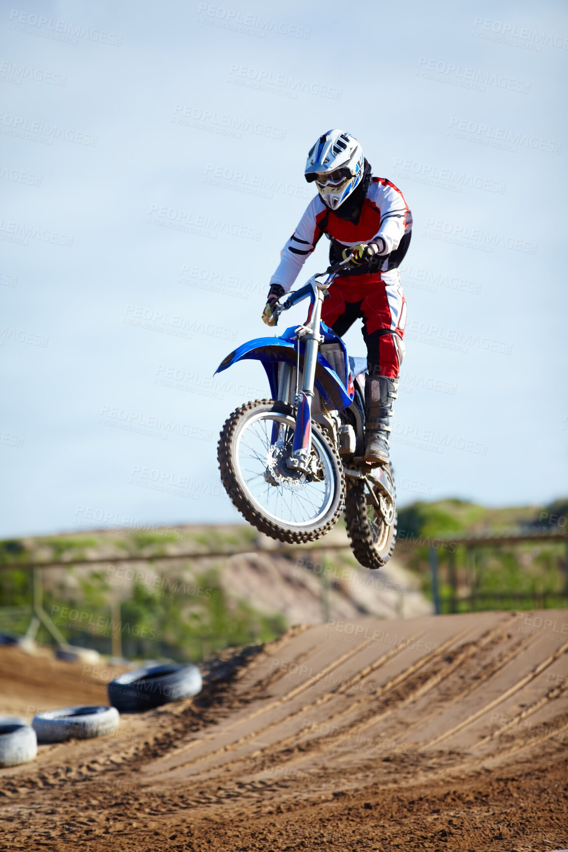 Buy stock photo Person, motorcycle or bike hill jump as professional in action danger competition, fearless or race risk. Rider, off road transportation or fast speed dirt adventure or rally, extreme sport or gear
