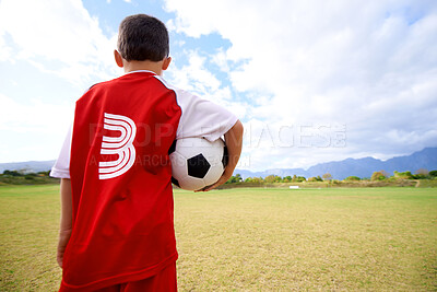 Buy stock photo Child, back view and soccer player on field for fitness, workout and ready for training on grass. Boy, athlete and ball for exercising and skill development, practice and wellness or sports and match