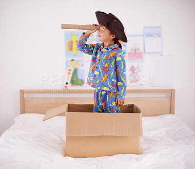 Buy stock photo A little boy playing pirate in a cardboard box