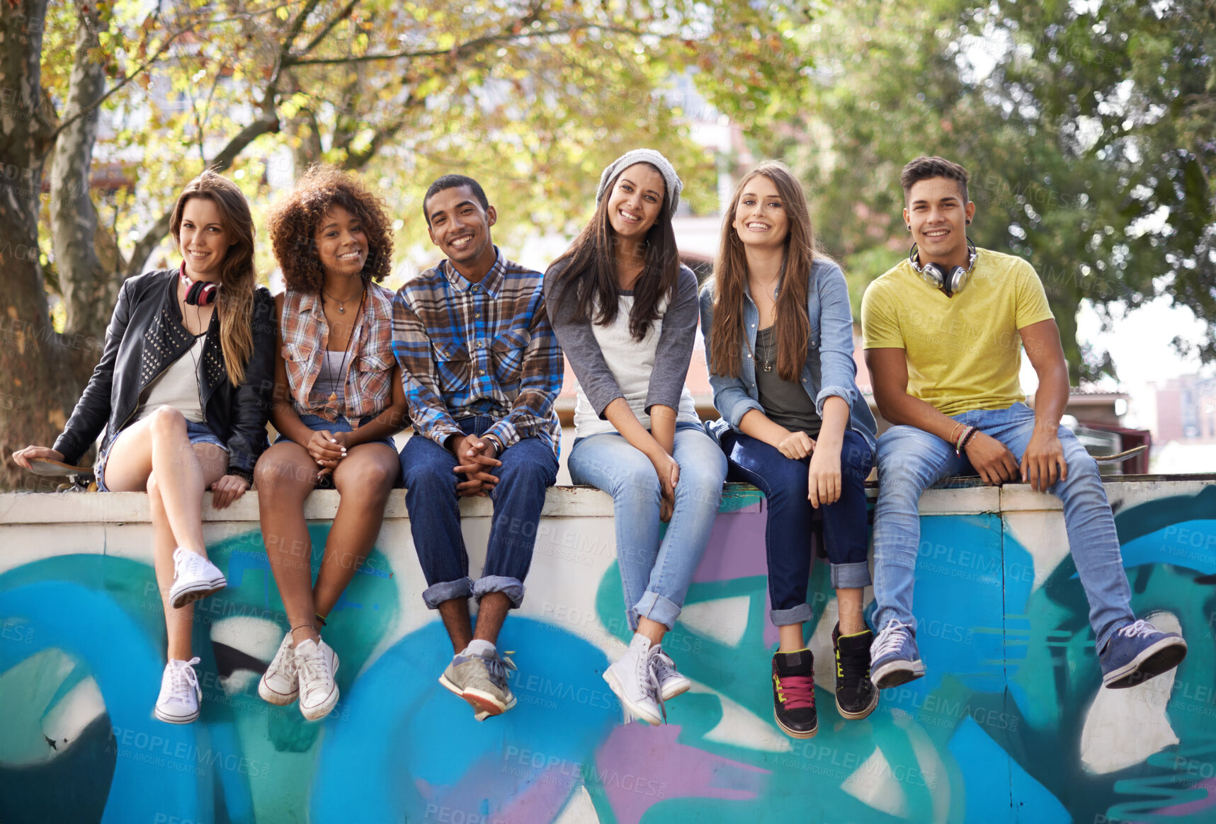 Buy stock photo A group of friends chilling outdoors during the summer