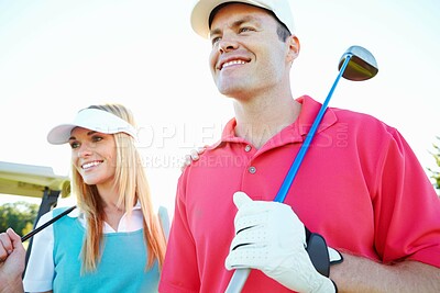 Buy stock photo Golf course, couple and club for game, fitness or weekend hobby together on vacation. Exercise, smile and happy woman with man on green for competition, outdoor challenge and holiday sports turf