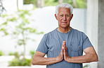 Namaste, zen and meditation for senior man, portrait and wellness with yoga, spiritual or mindfulness. Outdoor, chakra and healthy in retirement, peace and relax for mature person, pensioner and calm