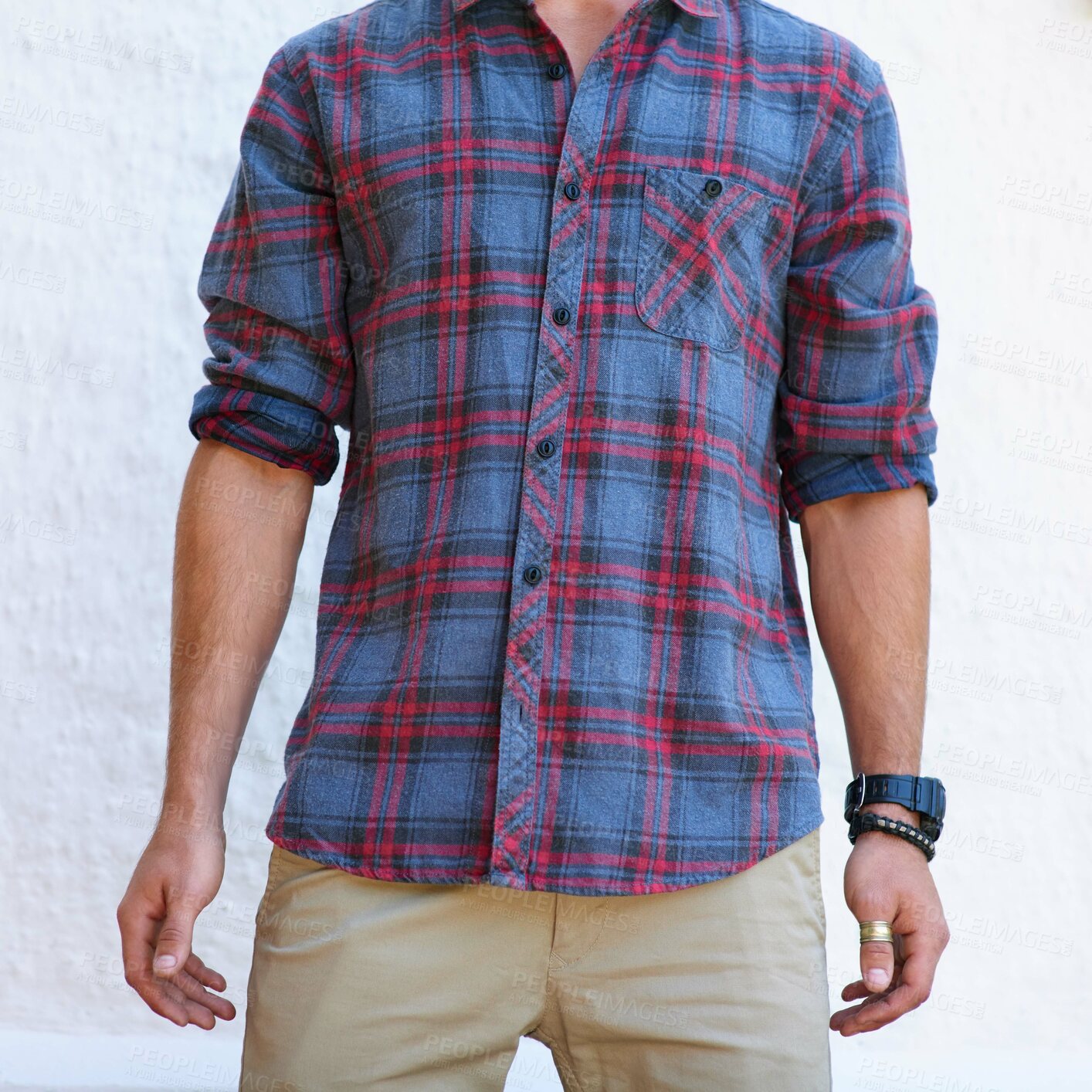 Buy stock photo Man, jewelry and trendy clothes with hipster style and fashion outdoor with tattoo and bracelet. Arms, edgy and checkered shirt with cool guy aesthetic and white wall with watch accessory on weekend