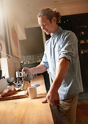 Buy stock photo Man, counter and coffee in home with espresso, mug and hot drink in the morning in kitchen. Breakfast blend, caffeine break and weekend with latte and brewing mocha with thinking and smile with food