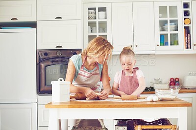 Buy stock photo Mother, girl and dough for baking in kitchen, dessert preparation and teaching child skill in home. Mama, daughter and love for helping with cookies, cooking wheat and kid learning with rolling pin