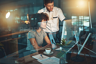 Buy stock photo Shot of colleagues working late at the office