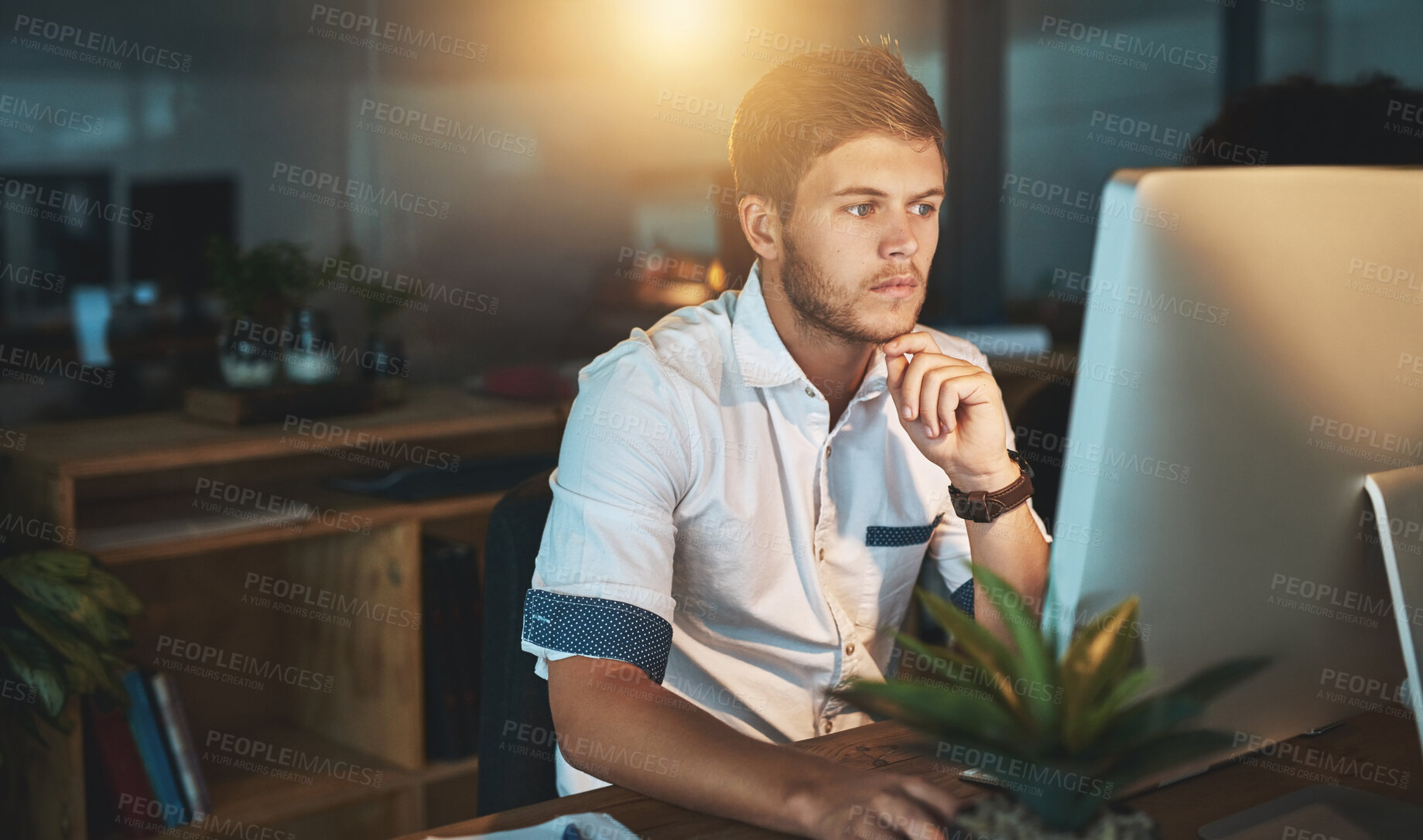 Buy stock photo Shot of a young designer working late