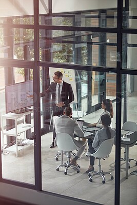 Buy stock photo Shot of a businessman giving a presentation in the boardroom