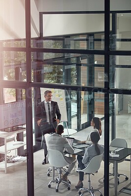 Buy stock photo Shot of a businessman giving a presentation in the boardroom