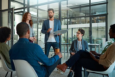 Buy stock photo Cropped shot of a group of creatives having a meeting in a modern office