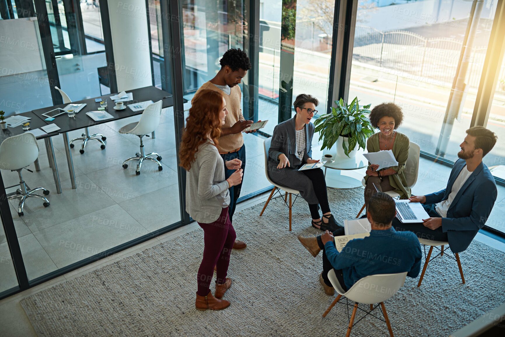 Buy stock photo Shot of a group of creatives having a meeting in a modern office