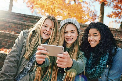 Buy stock photo Selfie, happy or girl friends in park for social media, online post or profile picture together in autumn. Relax, diversity or gen z girls with smile for photo on a fun holiday vacation in nature 