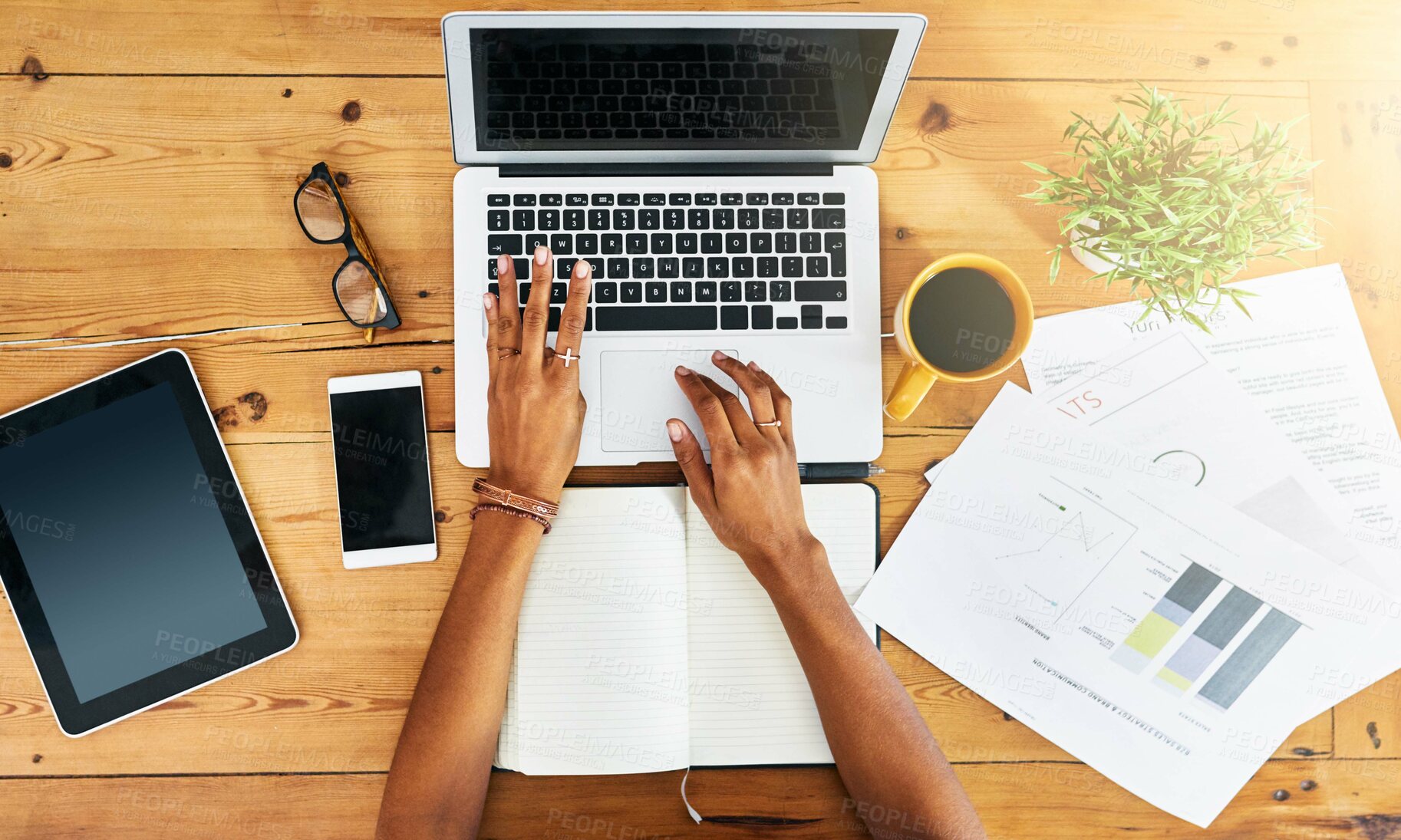 Buy stock photo Shot of an unrecognizable woman working from home