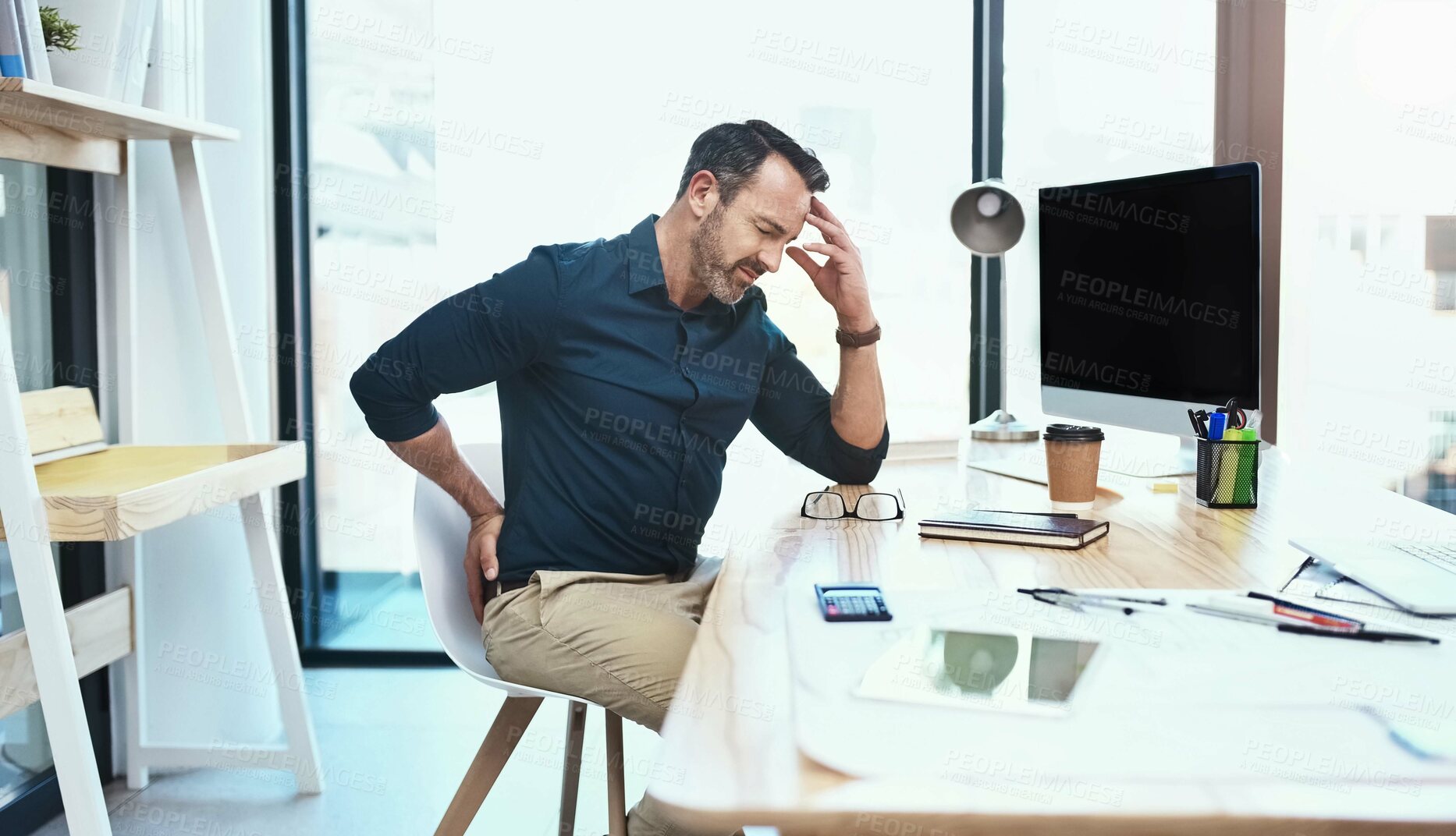 Buy stock photo Businessman with stress, back pain and headache in the office while working on a project. Medical emergency, healthcare and mature professional employee with a migraine and sprain muscle in workplace