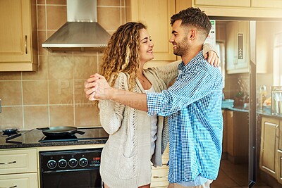 Buy stock photo Couple, smile and dancing in kitchen in home for celebration, bonding and holding hands. People, romance and dancer in house with music playlist, support and connection for trust, love or commitment