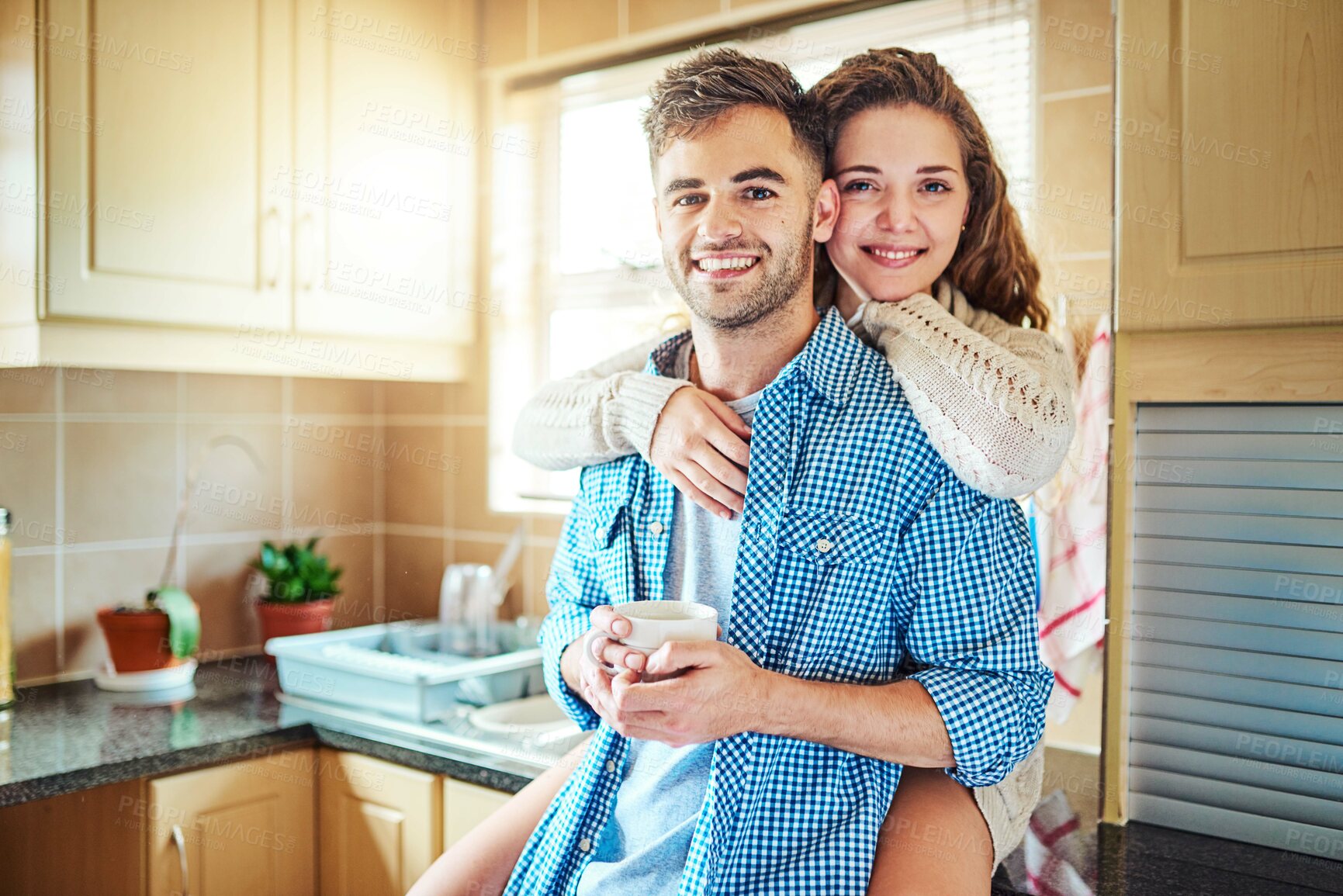 Buy stock photo Happy woman, portrait or couple hug in kitchen for love with support, smile or soulmate partner. Embrace, home or people bonding in relationship together for affection, romance or commitment in Spain