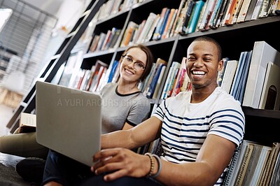 Buy stock photo Students, laptop and portrait in library for college, learning and education with collaboration and books. Man, woman and study on university campus for research project, scholarship or online course