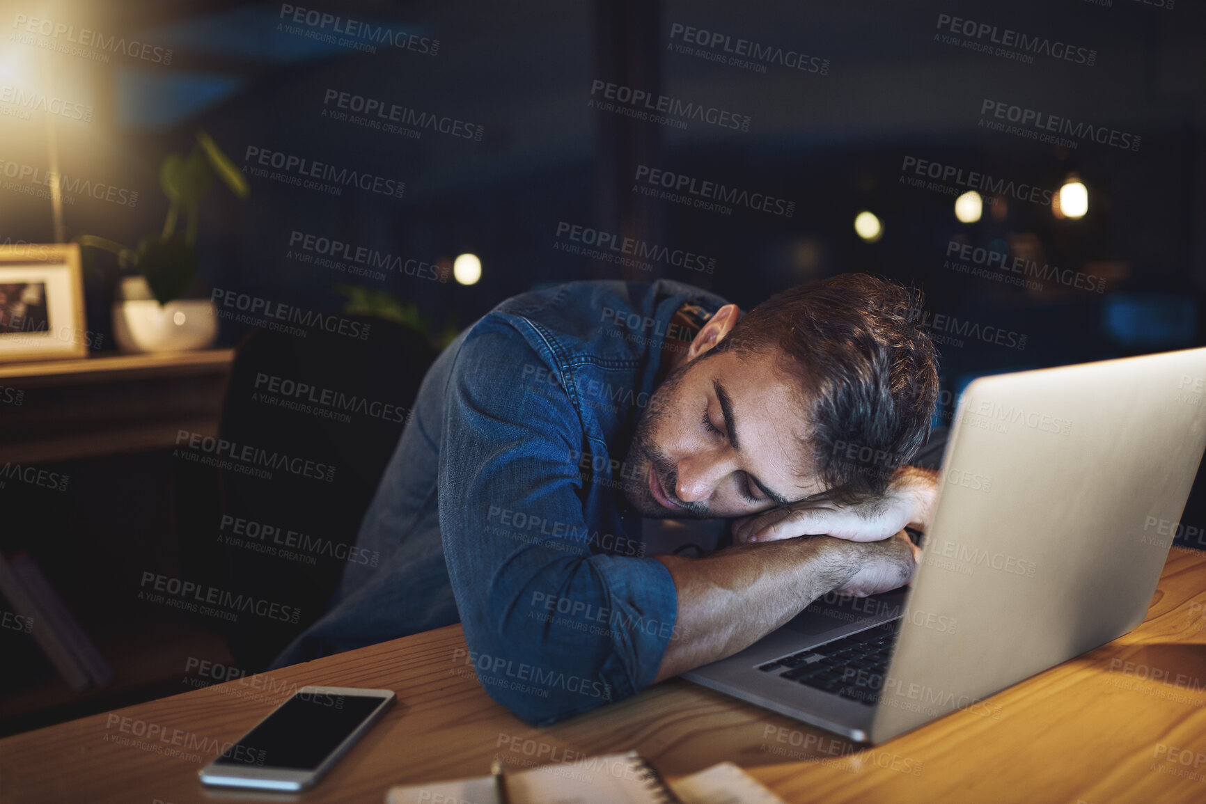 Buy stock photo Man, tired and sleeping at night in office with laptop, burnout and overtime with deadline at startup. Person, exhausted and fatigue by computer with rest, dream and break with job at creative agency