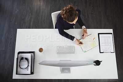 Buy stock photo Above, business and woman with notebook in office for information, company schedule and agenda notes. Girl, writing and administration with computer for kpi report, data entry and project feedback