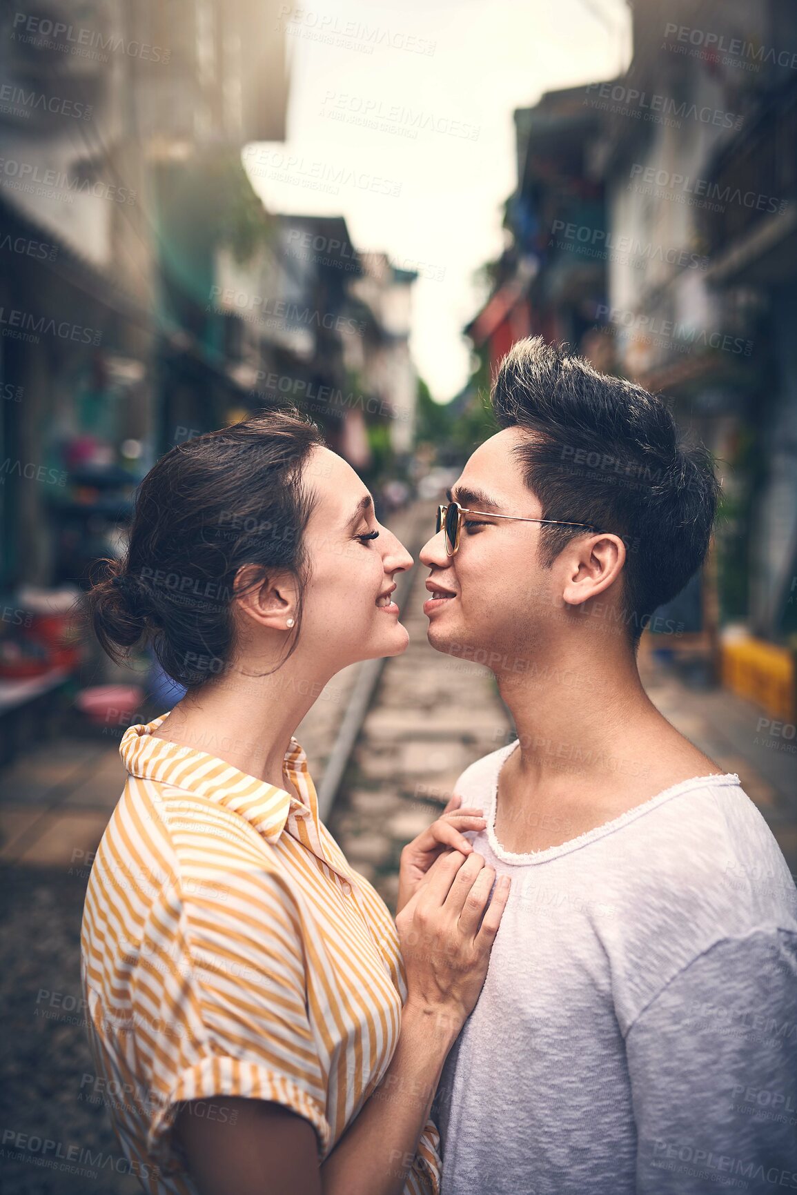 Buy stock photo Bonding, travel and couple in city for vacation, sightseeing and holiday for romance in relationship. Sunglasses, love and woman hug man for connection together in town for weekend trip in Vietnam.