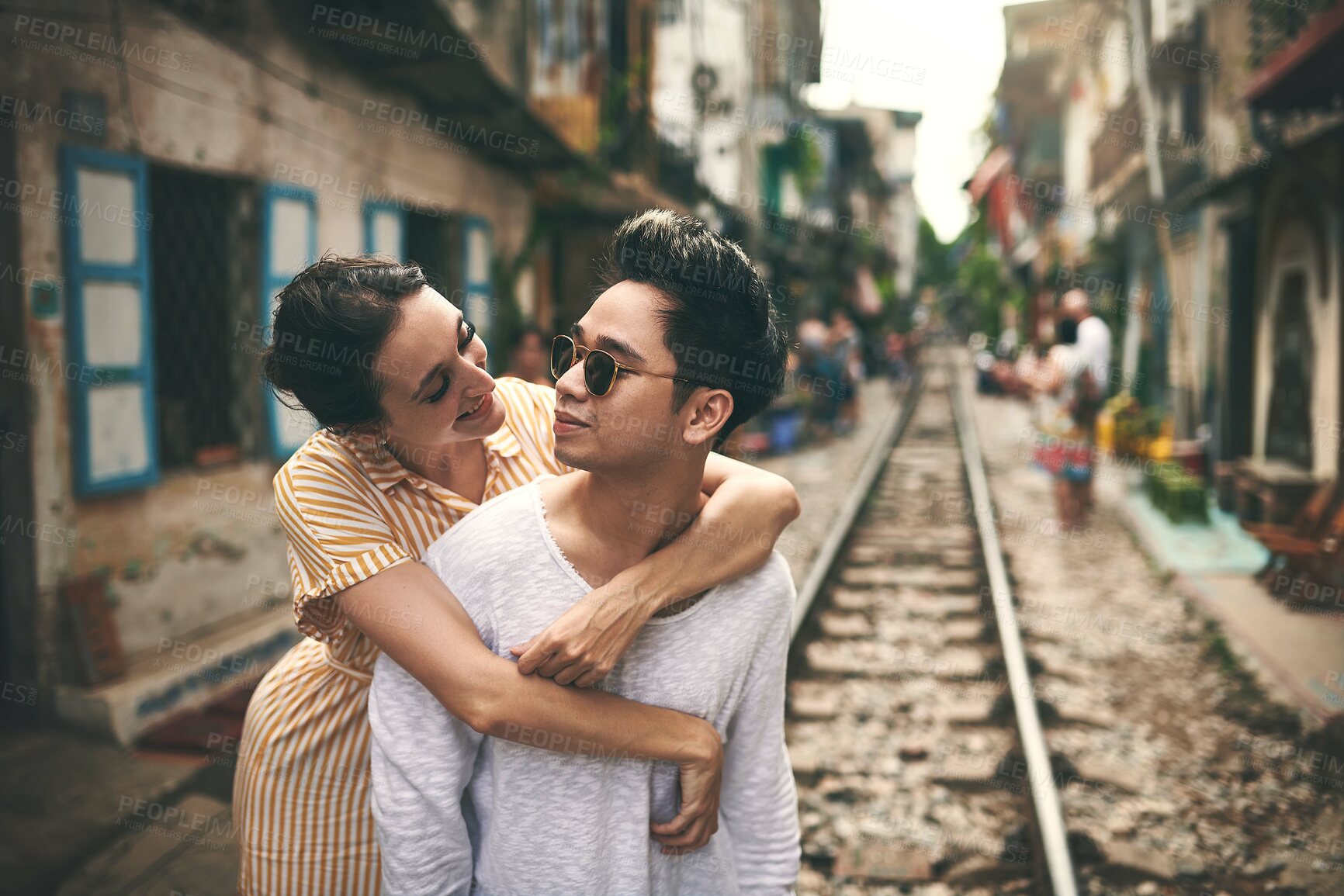 Buy stock photo Happy, hug and couple in city for vacation, sightseeing and holiday for romance in relationship. Sunglasses, love and woman hug man for bonding together in urban town for weekend trip in Vietnam.