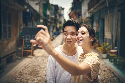 Buy stock photo Happy, travel and selfie couple in city for holiday, vacation and adventure on honeymoon. Street, love and man and woman take photo with smile for social media, memory and profile picture in Vietnam