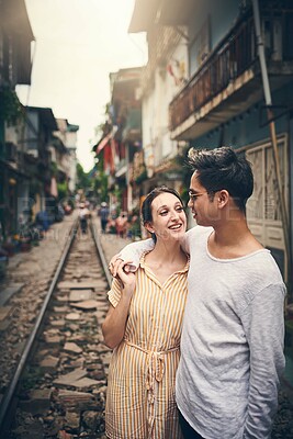 Buy stock photo Happy, connection and couple in city for vacation, sightseeing and holiday for romance in relationship. Travel, love and woman hug man for bonding together in urban town for weekend trip in Vietnam.